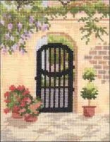 B&C City Gardens 3 - Arced Gate on Stucco Wall.JPG